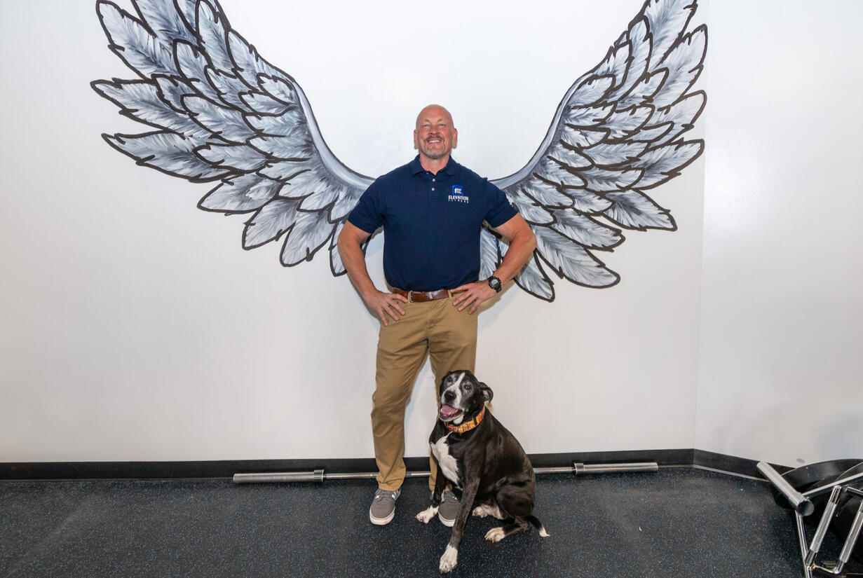 Elevation Fitness Trainer with Dog